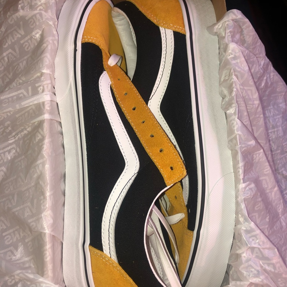 Black ,white and yellow authentic vans